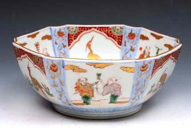 Appraisal: A JAPANESE IMARI HEXAGONAL BOWL having painted panels of figures