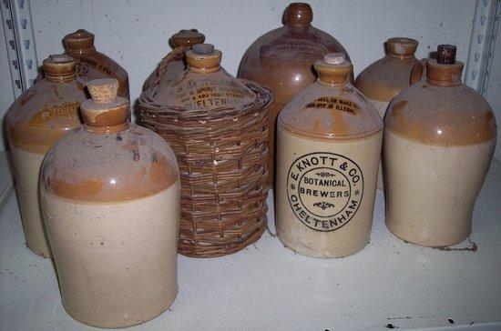 Appraisal: Nine brown glazed storage jars various local firms