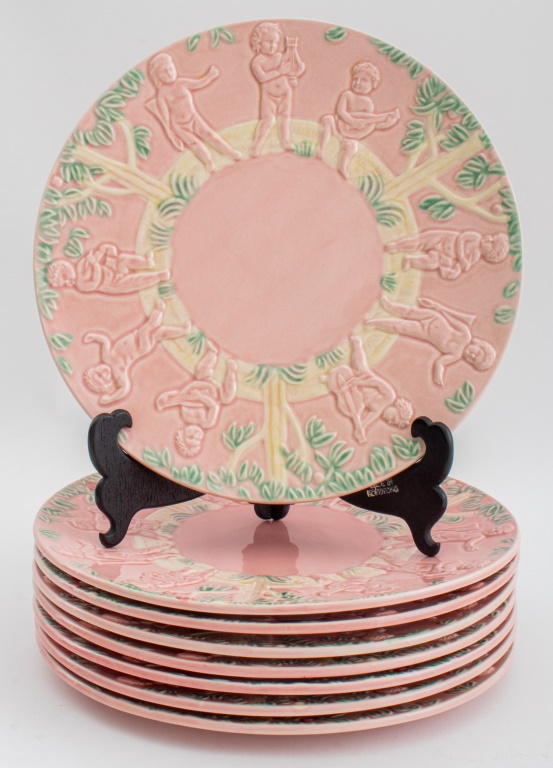 Appraisal: FRENCH MAJOLICA PINK CHERUBS CHARGERS PLATES Group of eight French