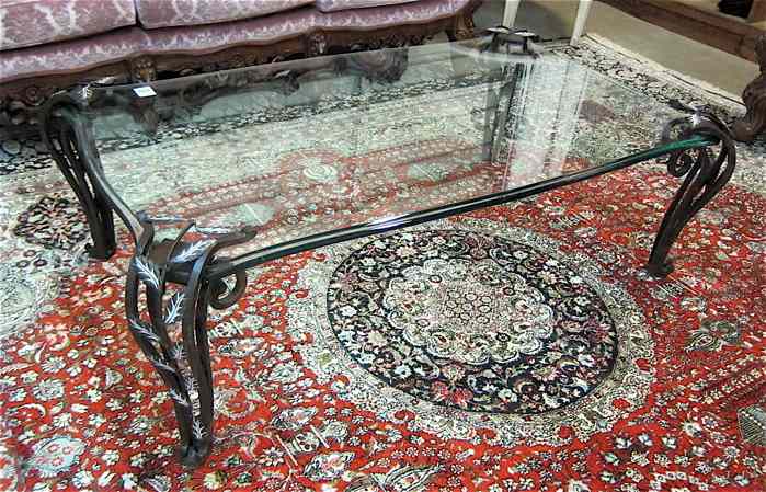 Appraisal: GLASS AND WROUGHT IRON COFFEE TABLE the rectangular beveled glass