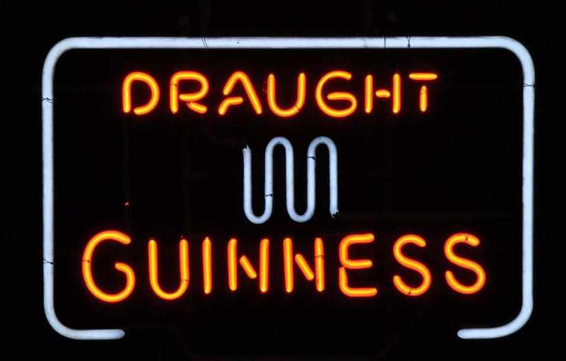 Appraisal: Guiness Draught Border Neon Sign Description s Red and white