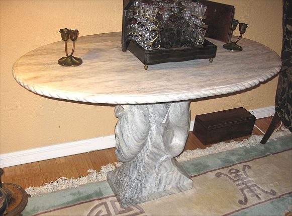 Appraisal: CARVED MARBLE PEDESTAL TABLE The base being in fish form