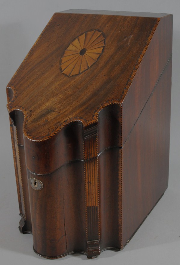 Appraisal: A George III mahogany knife box the sloping lid with