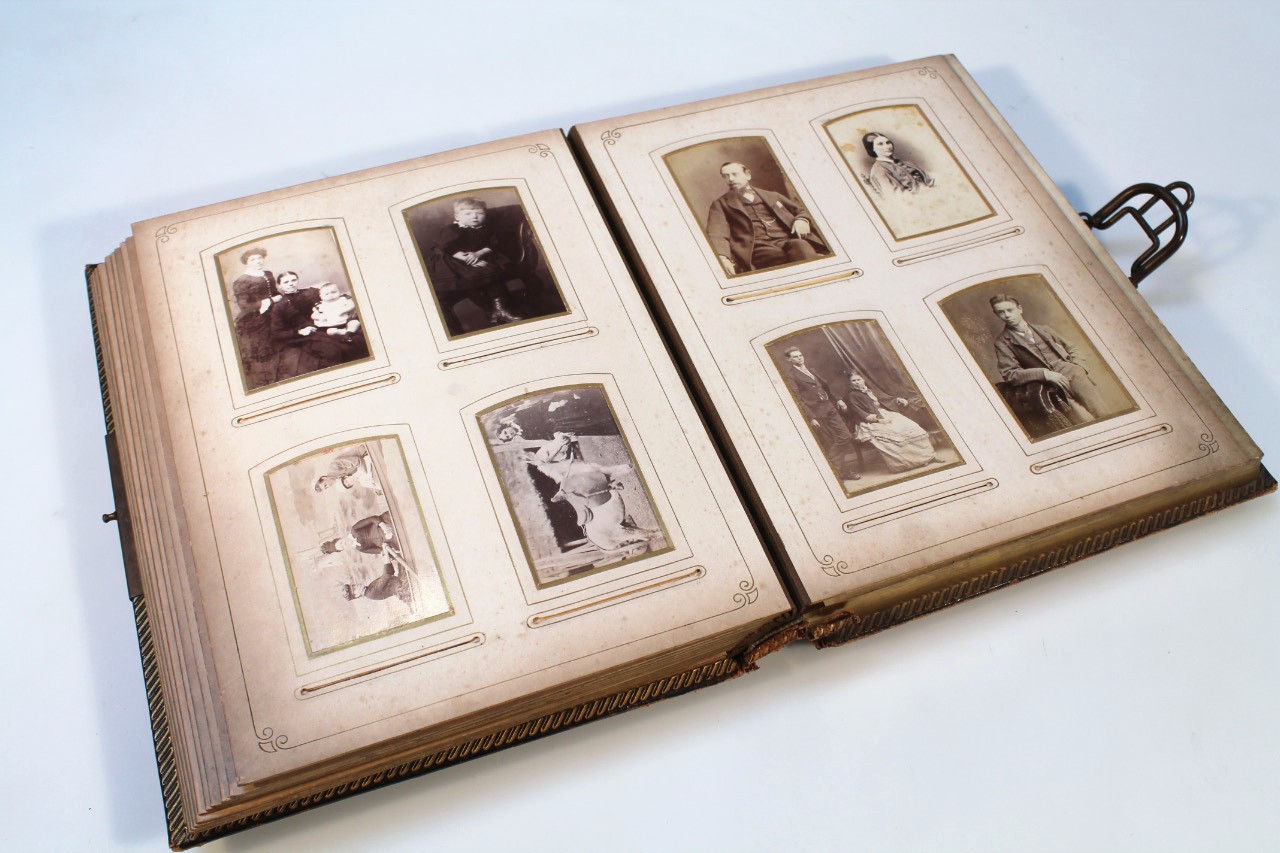 Appraisal: A Victorian musical photograph album containing a quantity of black