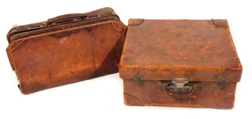 Appraisal: A canvas bound trunk and a leather gladstone bag AF