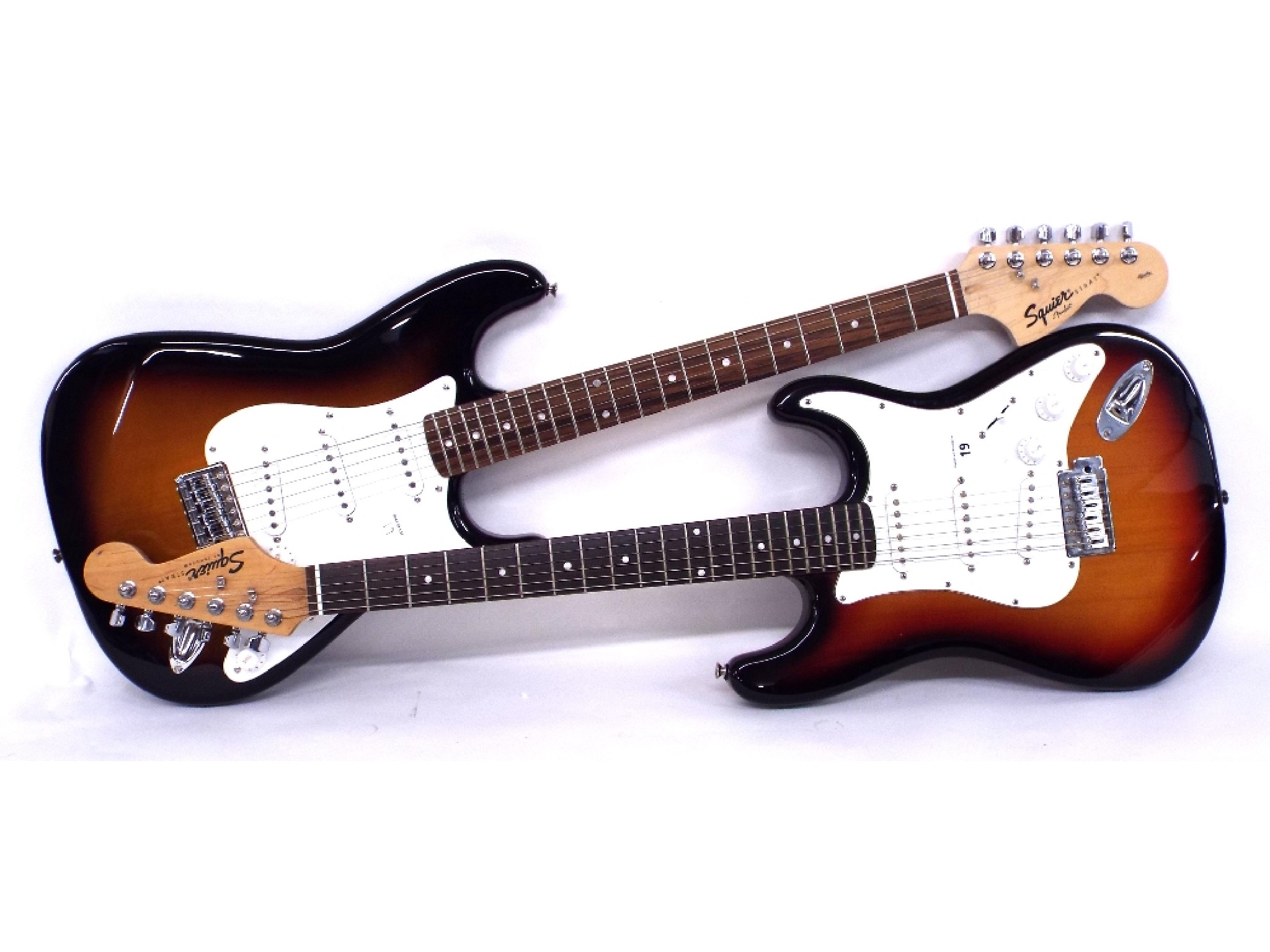 Appraisal: Two Squier Strat electric guitars both appear to be in