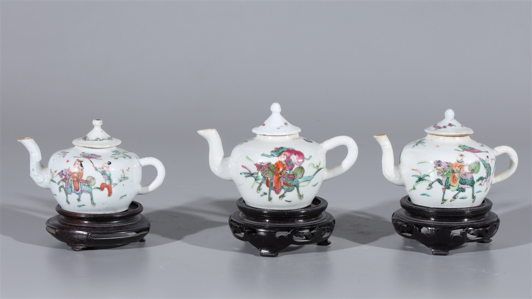 Appraisal: Three Chinese famille rose enameled porcelain teapots with gilt detail