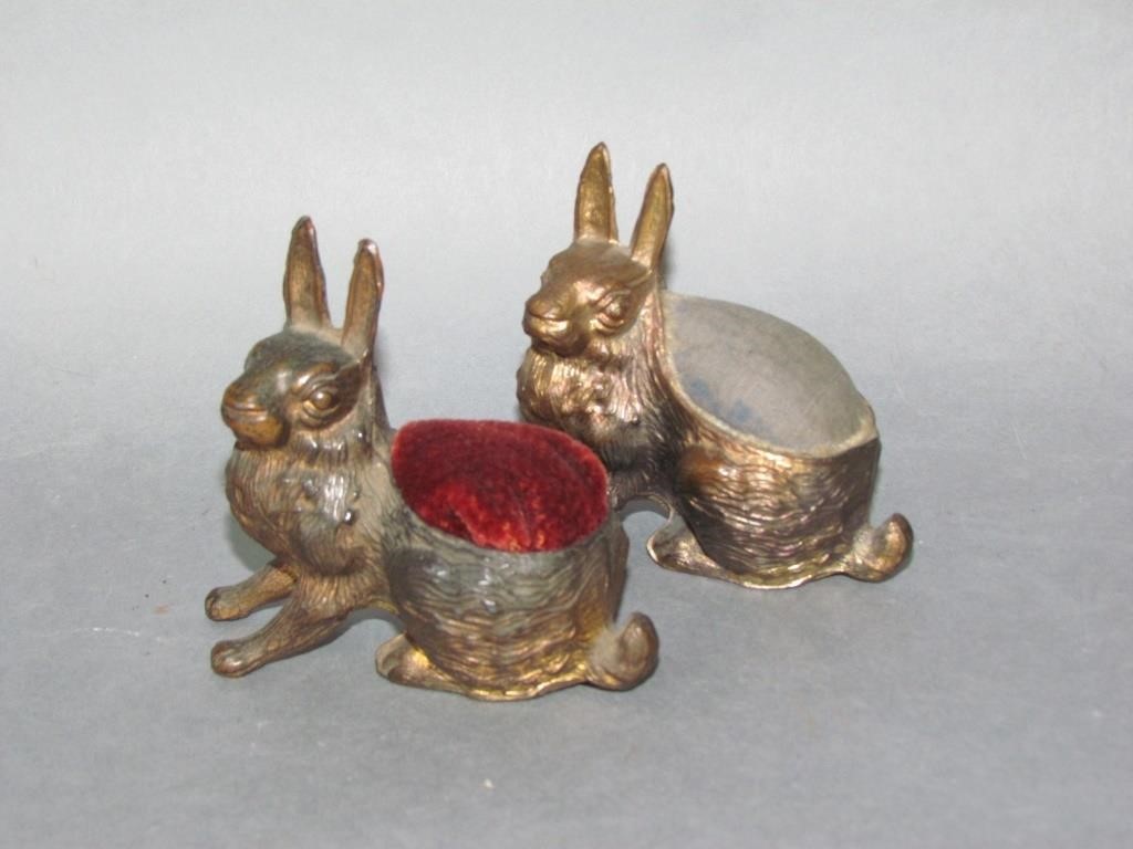 Appraisal: RABBIT SHAPED PIN CUSHIONSwhite metal bodies with fabric pin cushion