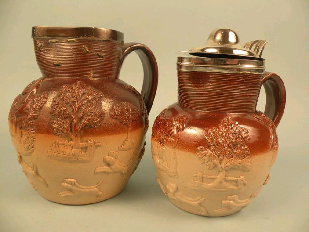 Appraisal: A thC stoneware jug with a silver mount and another