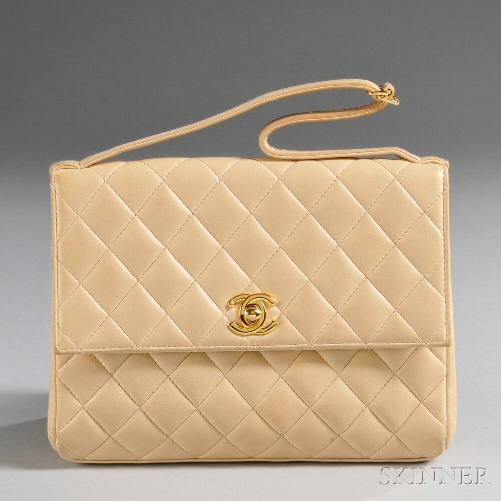 Appraisal: Chanel Camel-tone Quilted Lambskin Clutch with interlocking CC clasp and