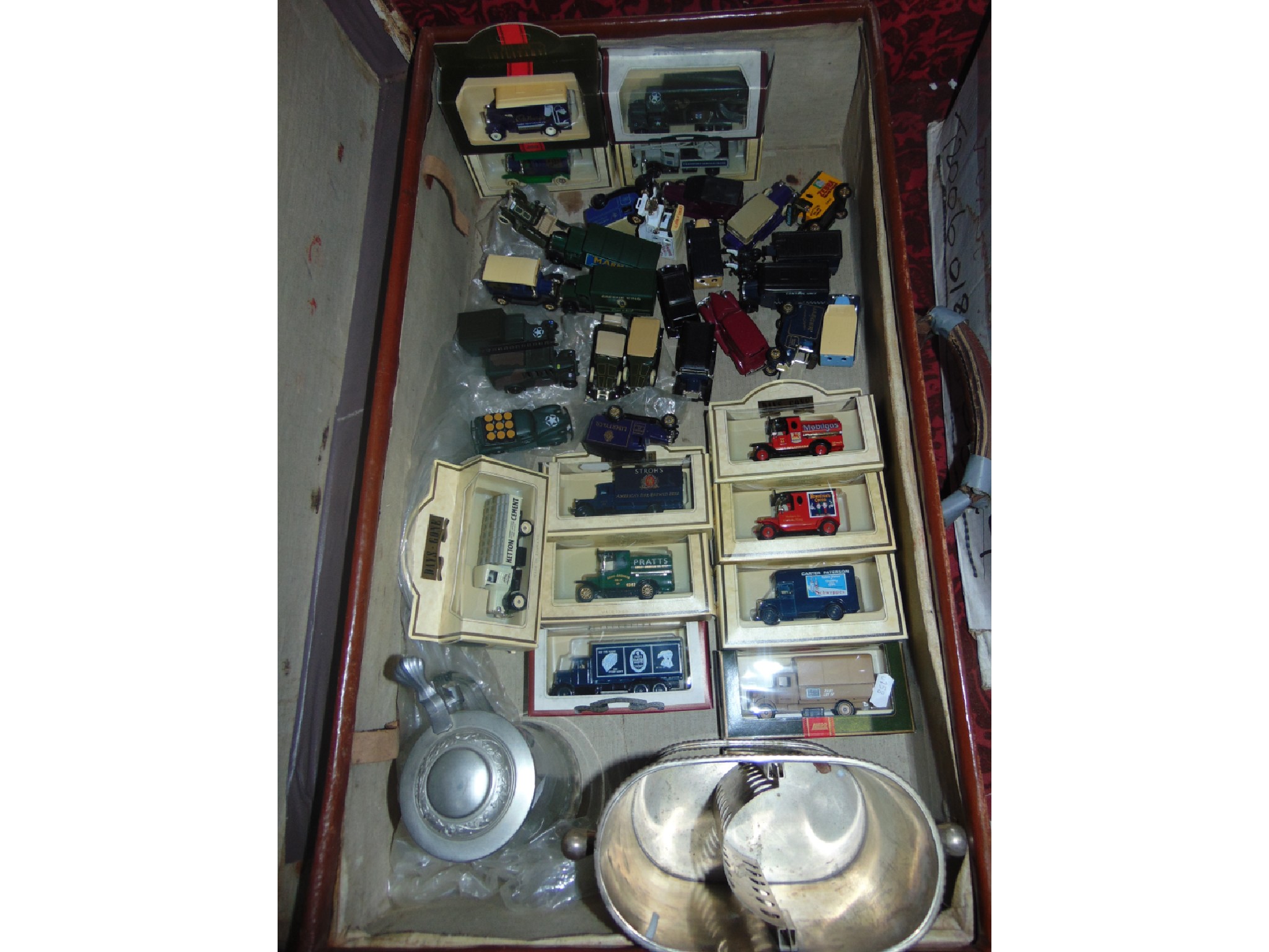 Appraisal: A stitched fibre suitcase containing a quantity of boxed 'Days