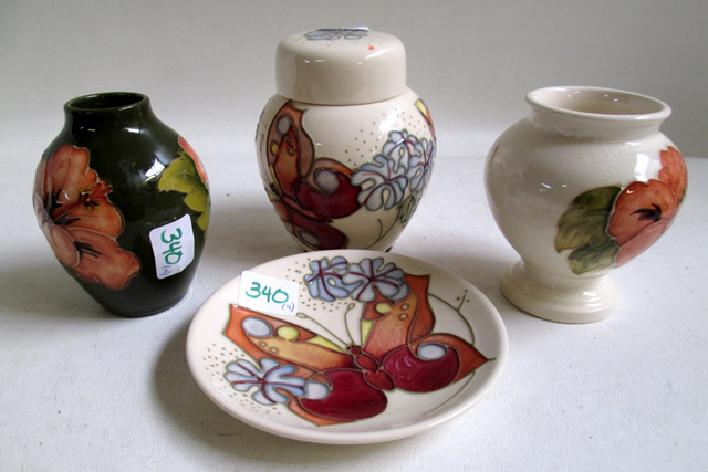 Appraisal: MOORCROFT POTTERY JAR DISH AND TWO VASES hand painted under