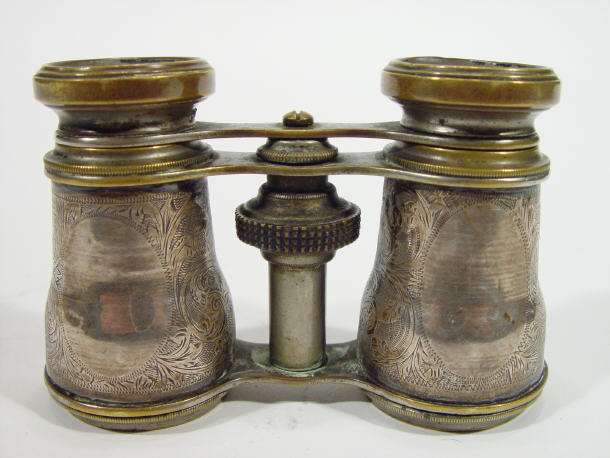 Appraisal: Pair of silver rimmed opera glasses with chased grips hallmarked