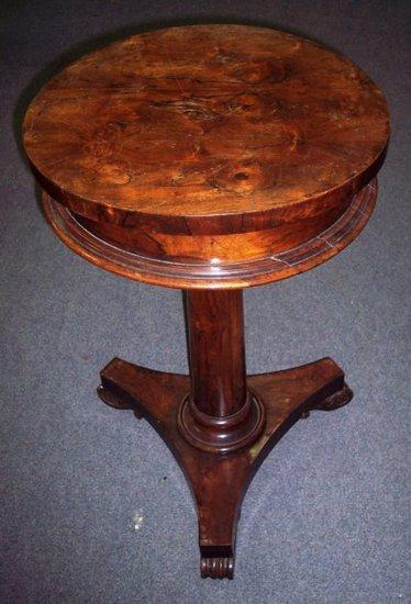 Appraisal: An early Victorian rosewood work table the circular top enclosing