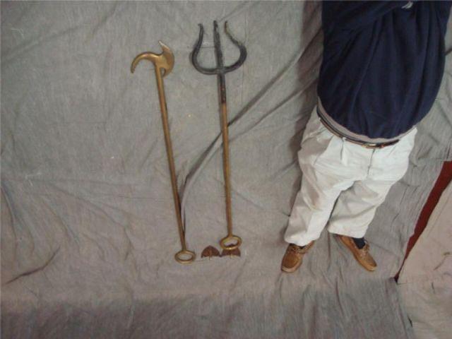 Appraisal: Huge bronze fireplace tools w wall hooks Dimensions and Estimate