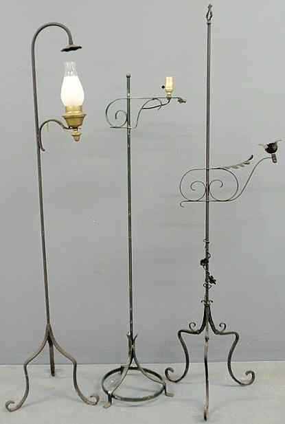 Appraisal: Three wrought iron standing floor lamps tallest h