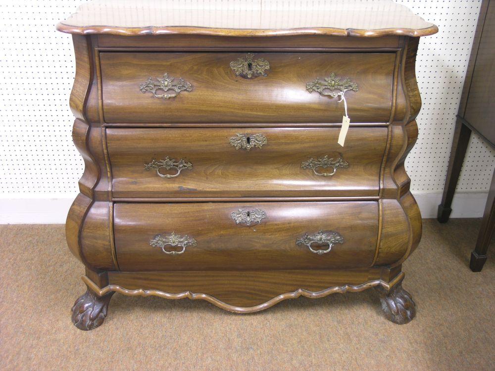 Appraisal: An th century Dutch mahogany bombe commode three drawers each