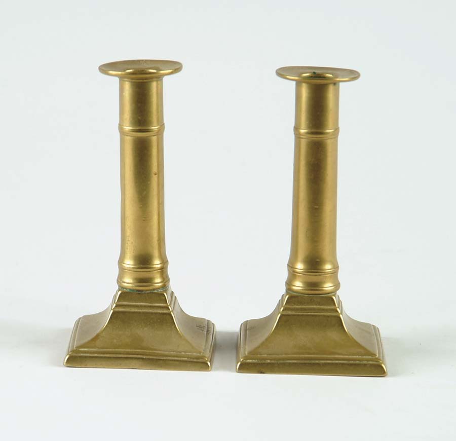 Appraisal: PAIR OF BRASS PUSH UP CANDLESTICKS Square bases push ups