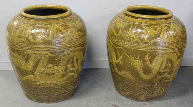 Appraisal: Magnificent Pair of Large Signed Asian CeramicUrns With overall dragon