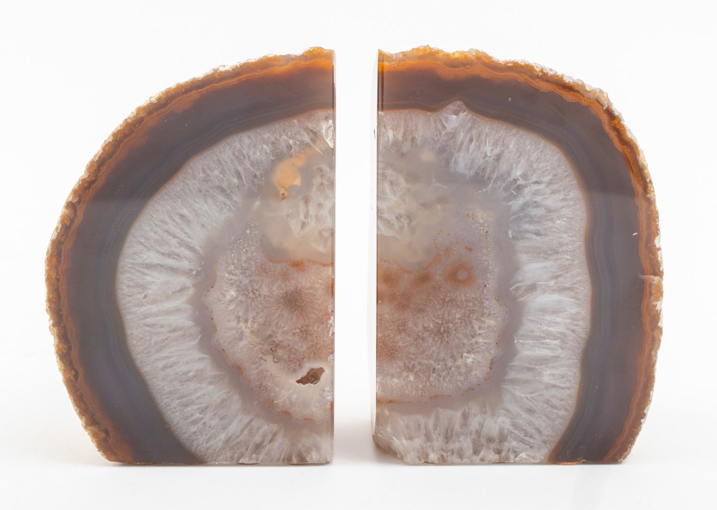 Appraisal: BANDED AGATE GEODE BOOKENDS PAIR Pair of banded agate rock