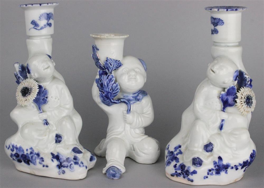 Appraisal: PAIR OF BLUE AND WHITE HIRADO FIGURAL CANDLESTICKS TH C