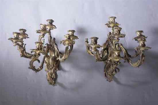 Appraisal: PAIR LOUIS XV STYLE GILT BRASS SEVEN-LIGHT WALL SCONCES late