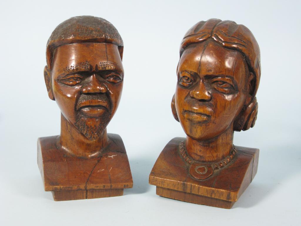 Appraisal: Pair of carved wooden Busts of Negro Man Woman in