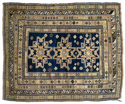 Appraisal: Kazak rug three medallions on blue field multiple floral and