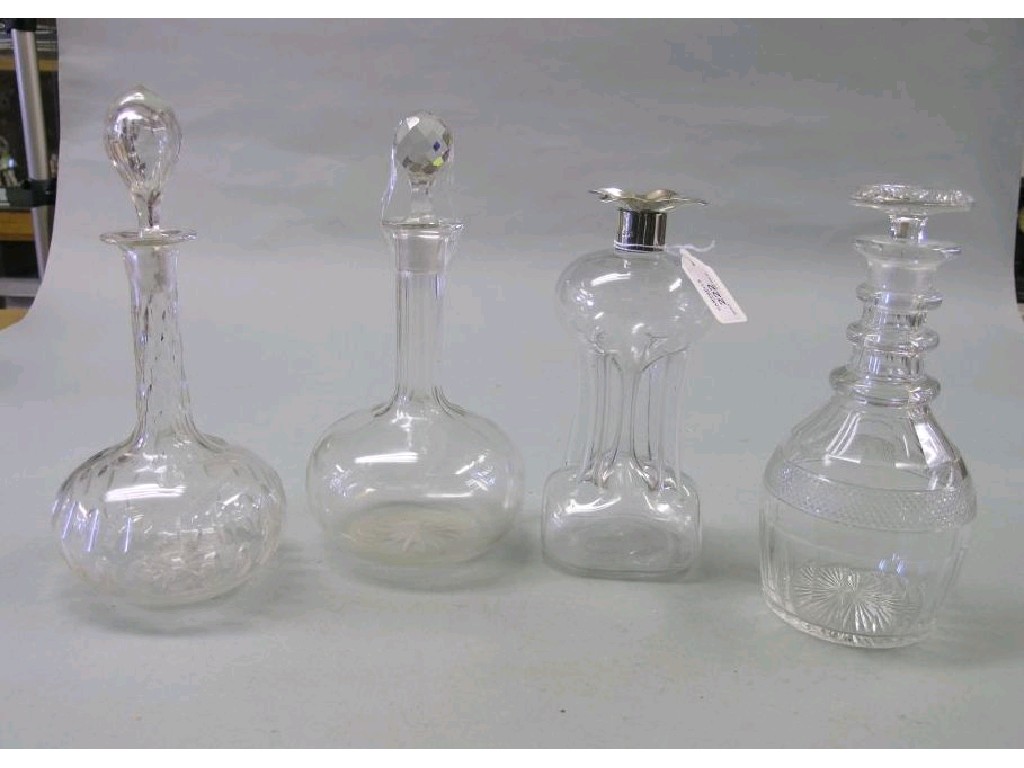 Appraisal: A Christopher Dresser-style pinched glass decanter with silver collar London