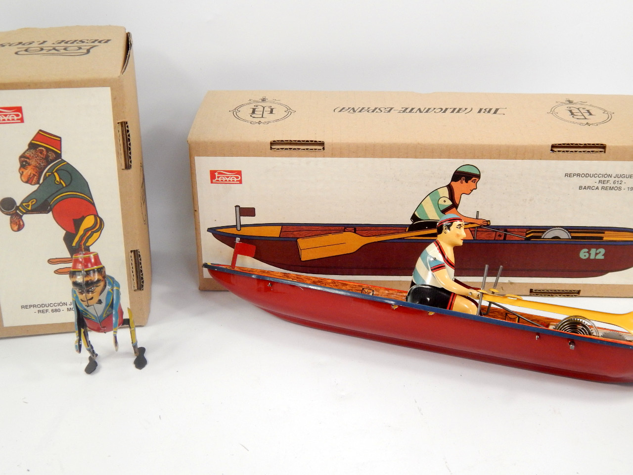 Appraisal: Jaya tin plate toys comprising a rower in boat and