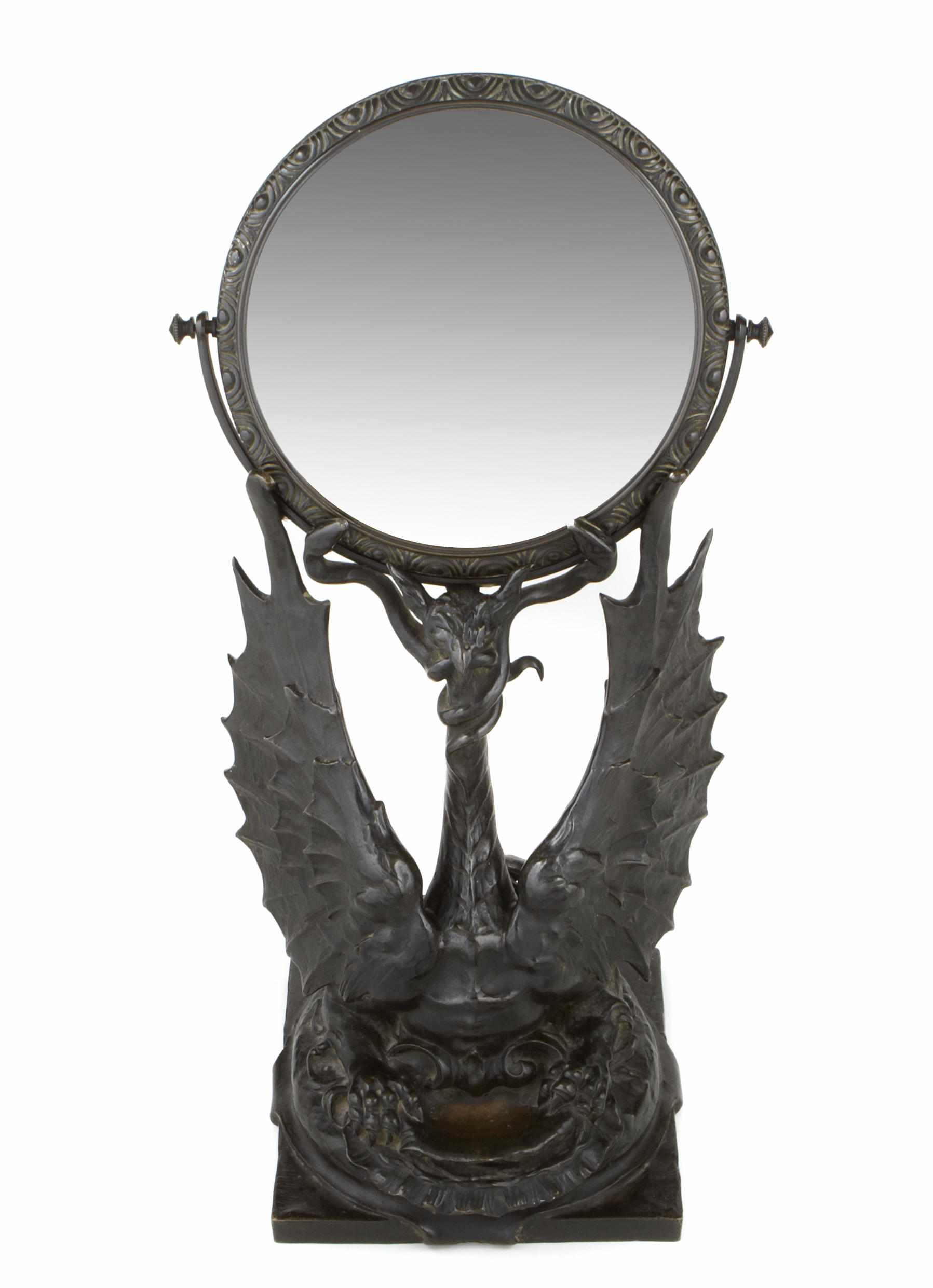 Appraisal: A cast iron dragon form dressing mirror signed E LA