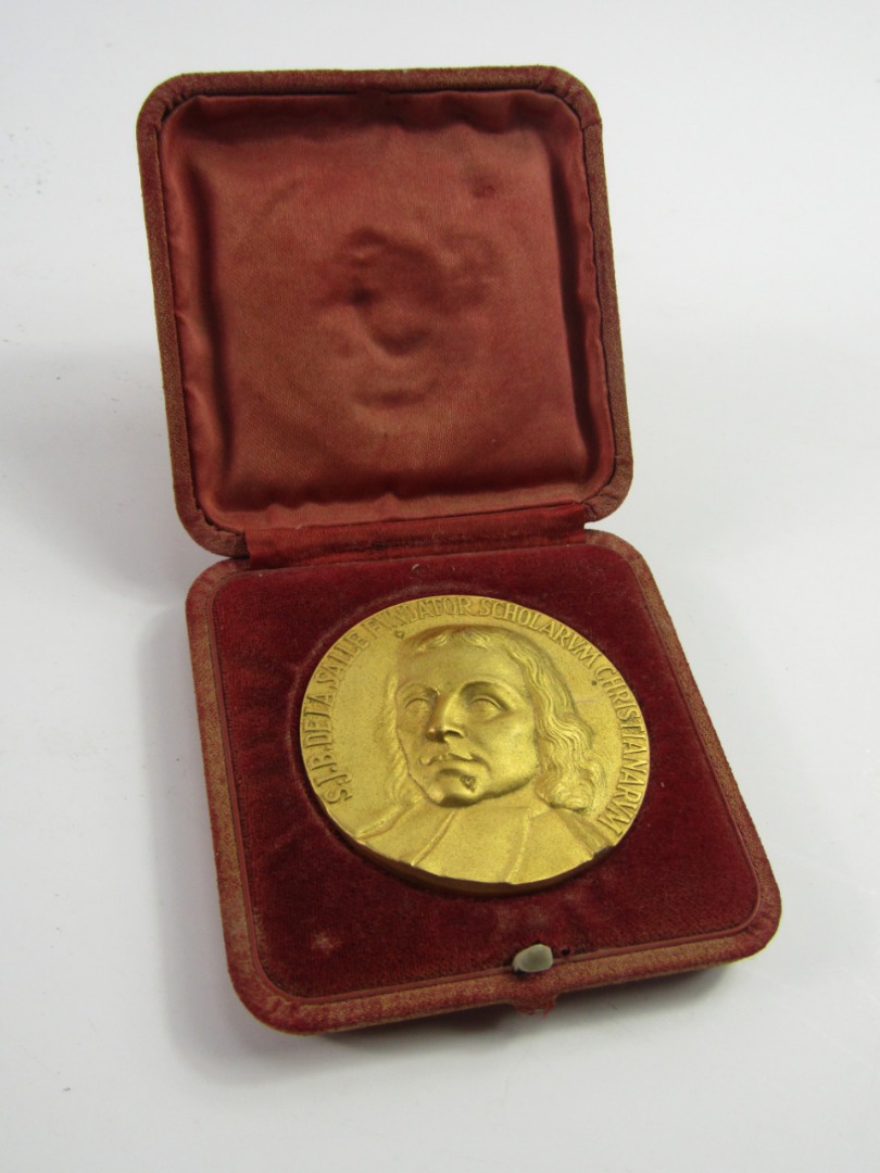 Appraisal: A De La Salle gilt metal medal awarded by The