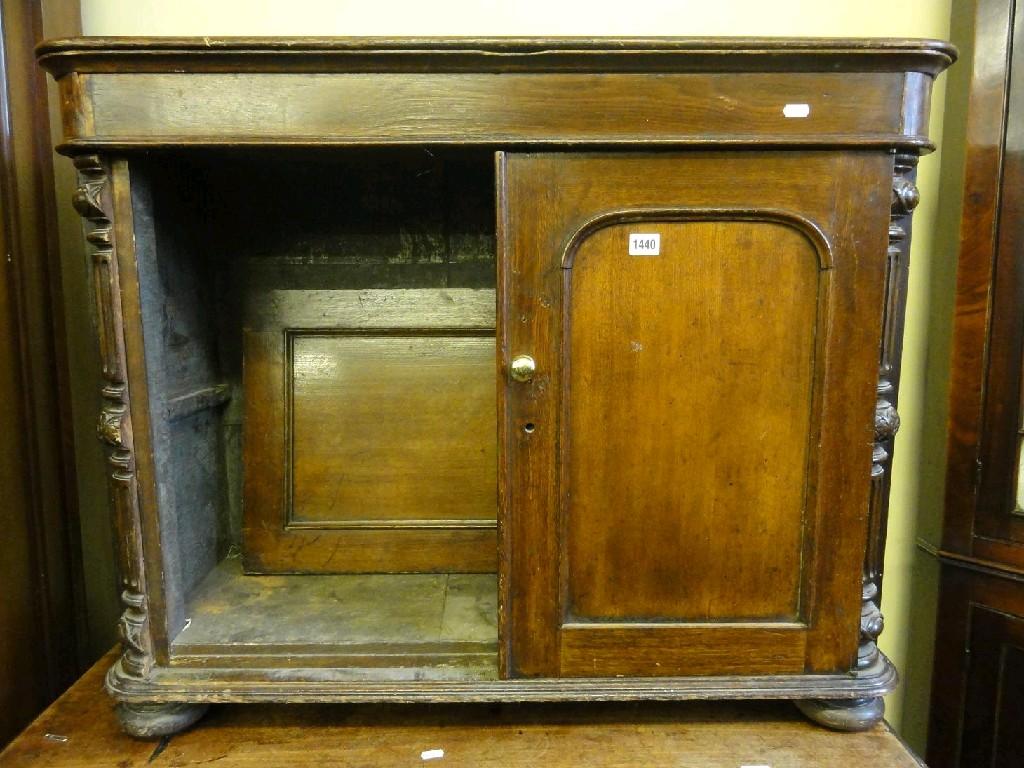 Appraisal: A Victorian low oak side cupboard enclosed by a pair