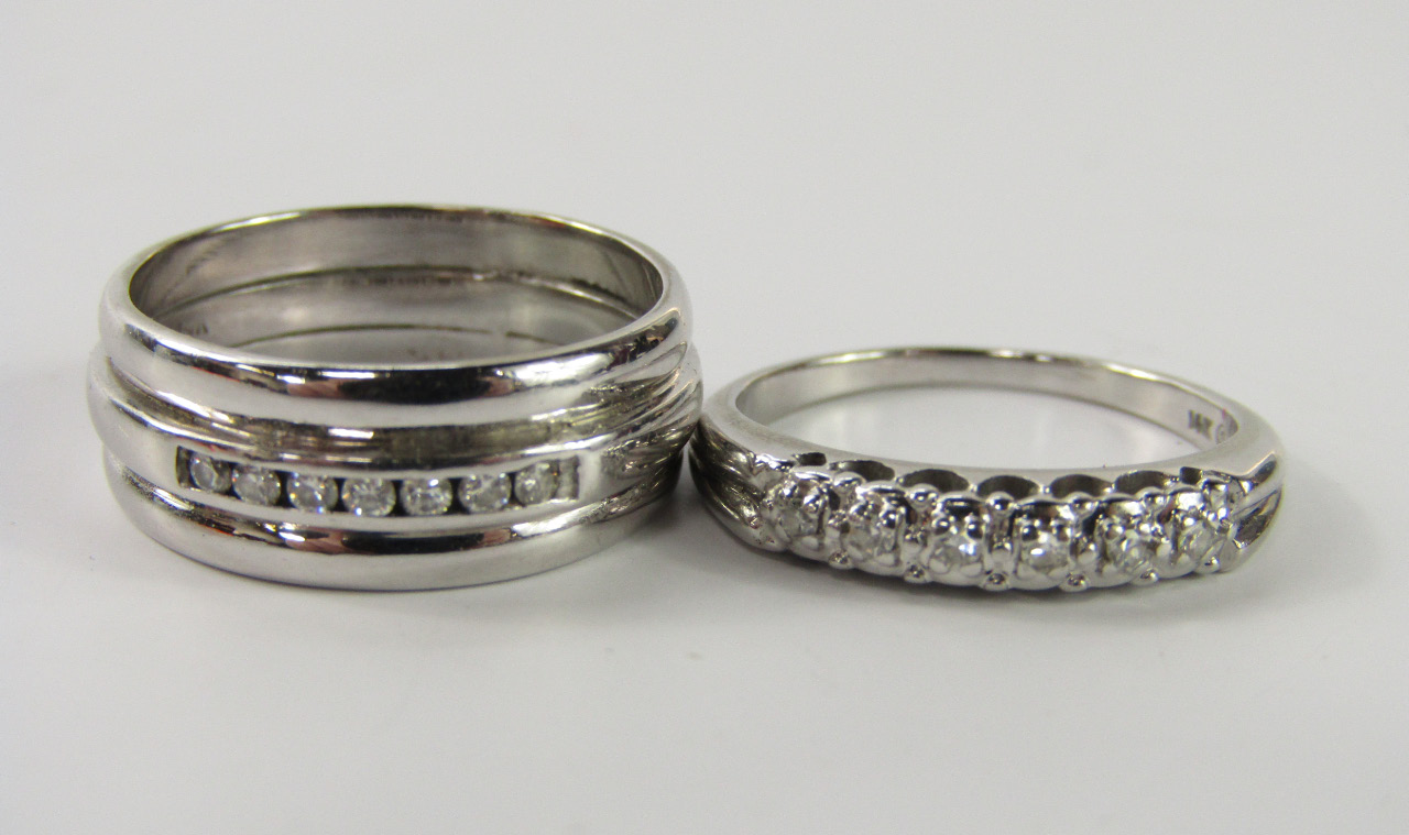 Appraisal: A white metal and diamond pave set band stamped k