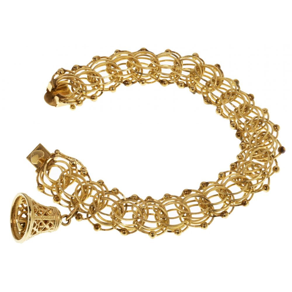 Appraisal: K YELLOW GOLD CHARM BRACELETTextured and polished spiral and ball