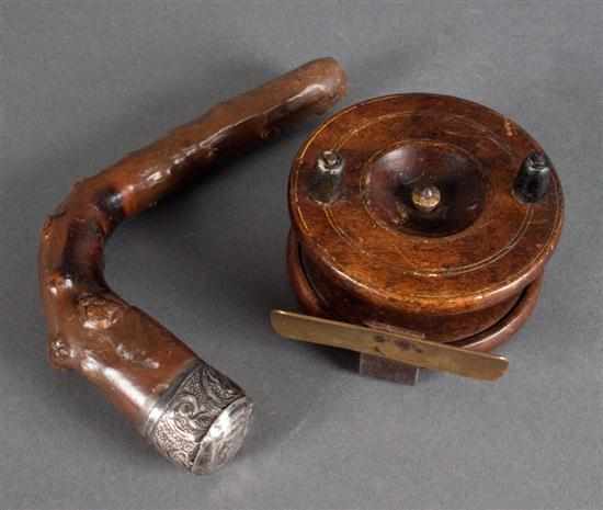 Appraisal: Early wood fishing reel and a root cane with silver