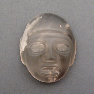 Appraisal: A carved rock crystal mask form pendant cm high