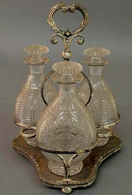 Appraisal: English Victorian silverplate decanter set th c with three cut