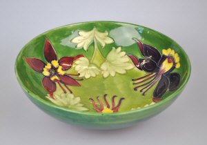 Appraisal: A Walter Moorcroft bowl variegated green ground decorated with Columbine