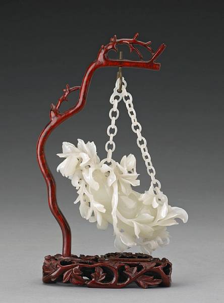 Appraisal: A white jade hanging pea pod th Century The large