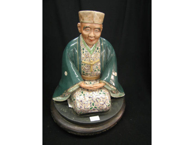 Appraisal: Oriental Figurine of a Seated Man polychromed decor custom base