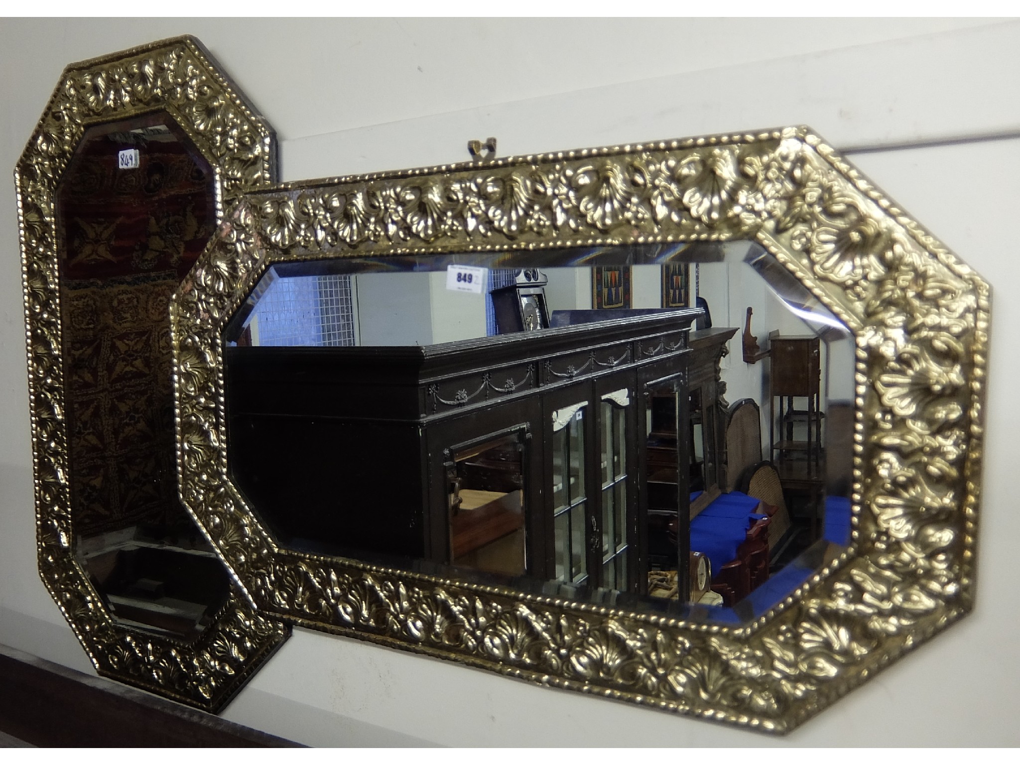 Appraisal: Pair of brass embossed wall mirrors