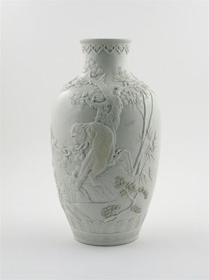 Appraisal: A Chinese white-glazed baluster vase carved and applied with a