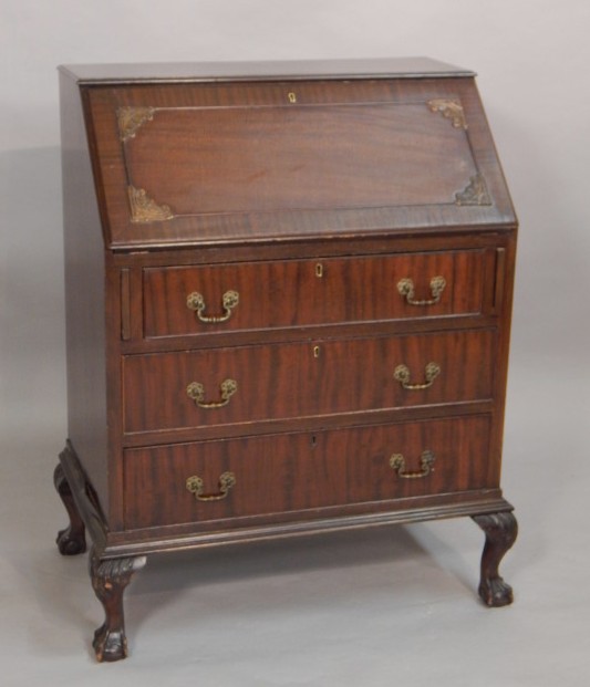 Appraisal: An early thC mahogany bureau the fall enclosing a fitted