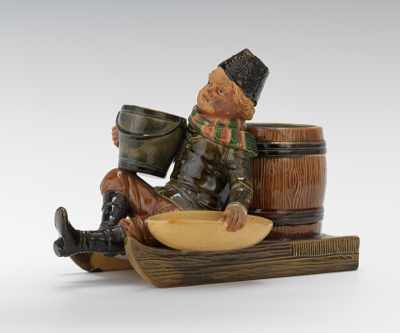 Appraisal: A Large Bernard Bloch Figural Match-Strike of Boy on Sled