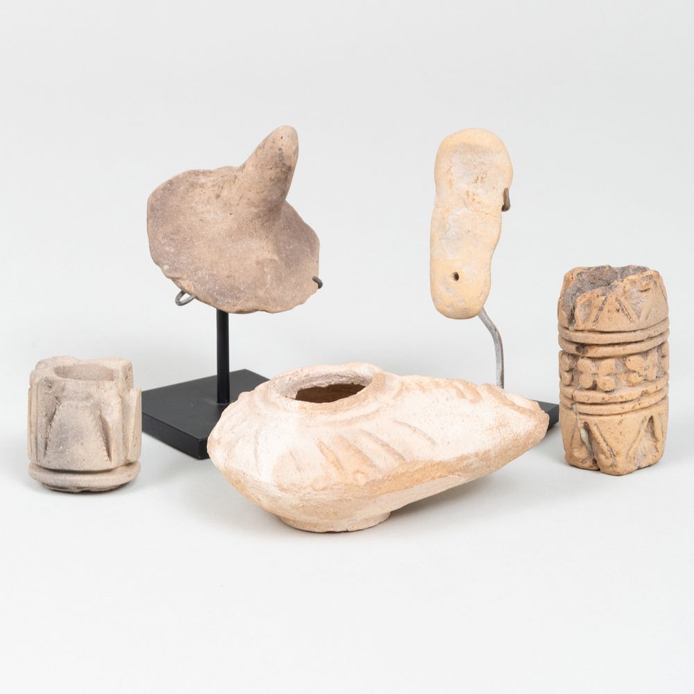 Appraisal: Group of Ethnographic Clay Ornaments Comprising An oil lamp A