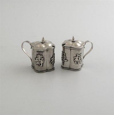 Appraisal: A pair of early th century Chinese small mustard pots