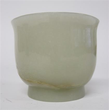 Appraisal: Chinese jade cupThe U-shaped cup with everted rim and footring