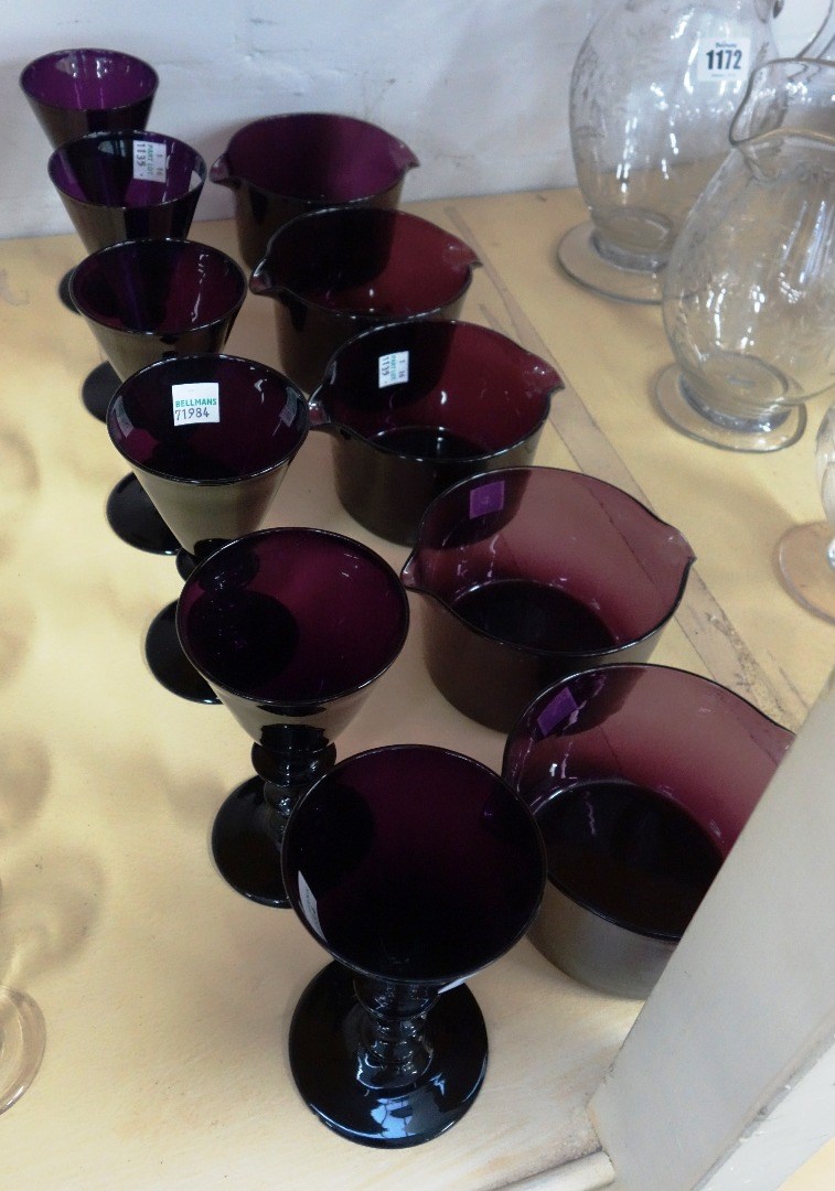 Appraisal: A set of six amethyst coloured wine glasses th century