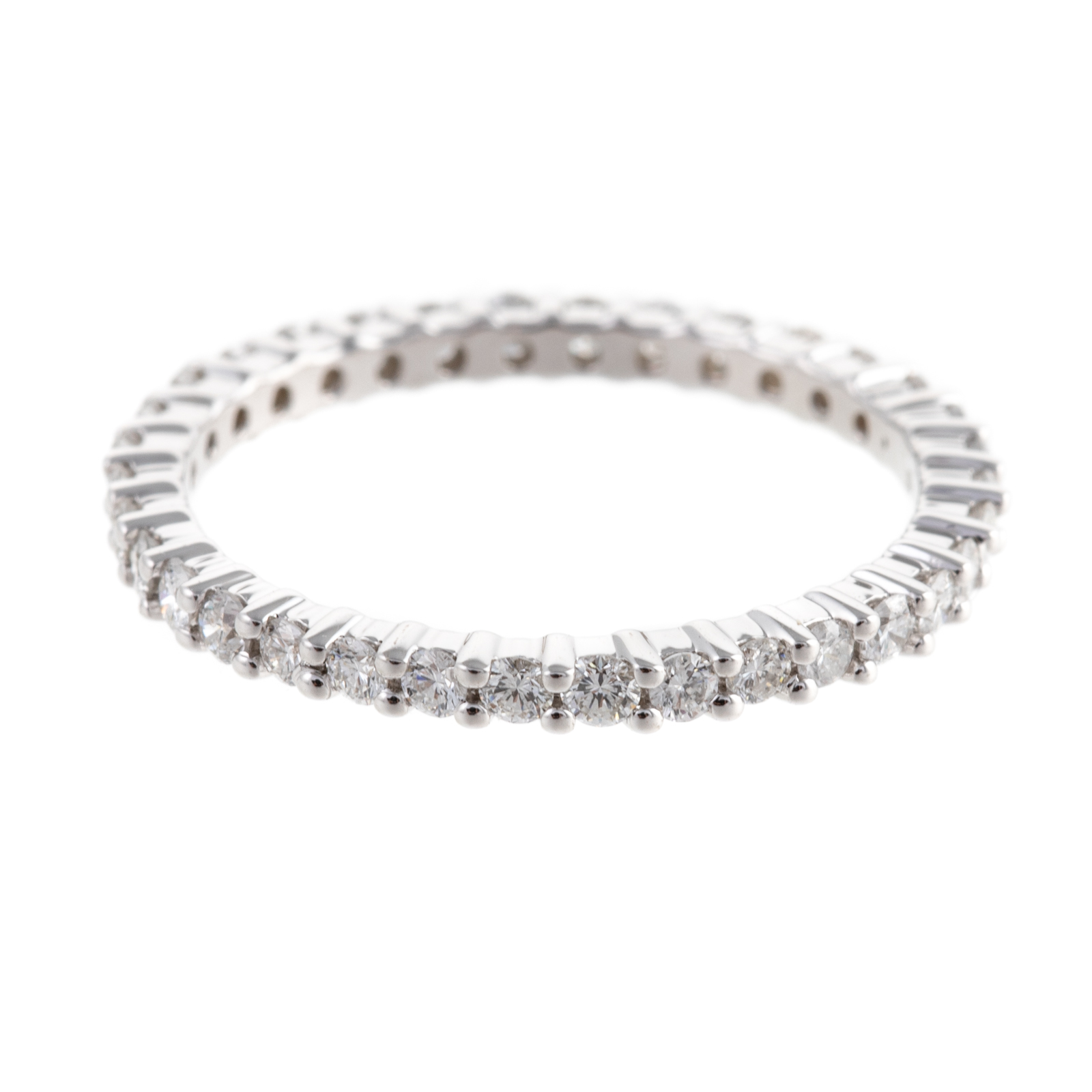 Appraisal: A DELICATE DIAMOND ETERNITY BAND IN K K white gold